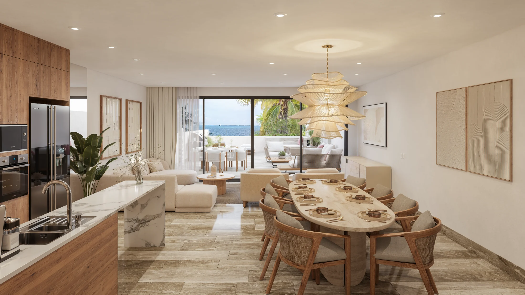Cocina, comedor y sala conectados con una terraza frente al mar
